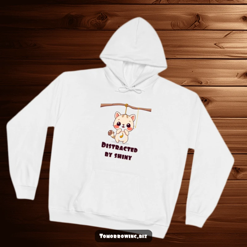 Funny hoodie featuring a cute animal character gleefully batting at a tempting, dangling string, radiating pure joy.